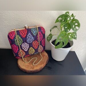 Saiesha box clutch with a sling chain amazingly perfect and elegant